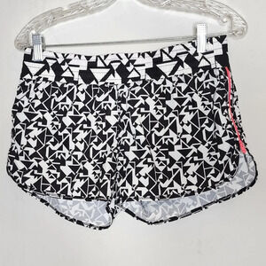 Lorna Jane running shorts. Pink side zippers. Built in shorts. Size XS.